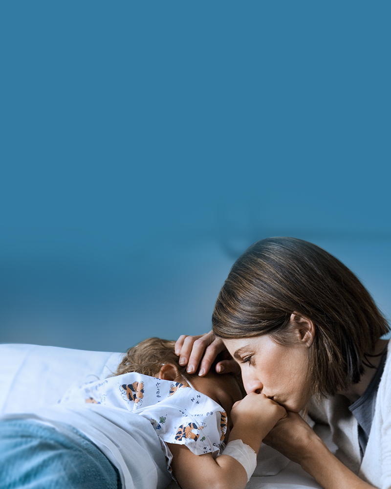 Mother cares for her sick child in hospital setting