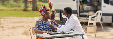Man and woman at desk with stethoscope