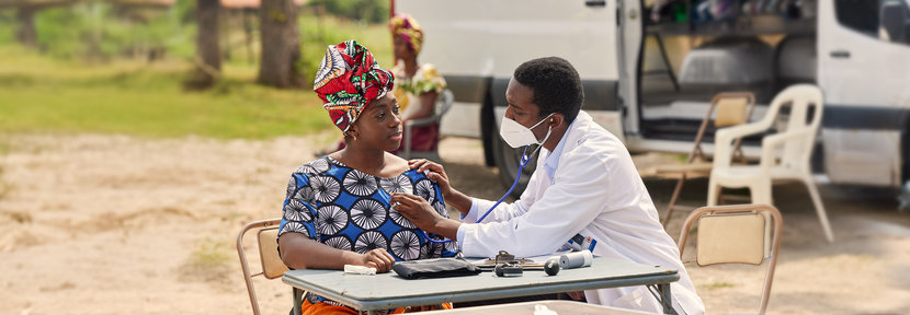 Man and woman at desk with stethoscope